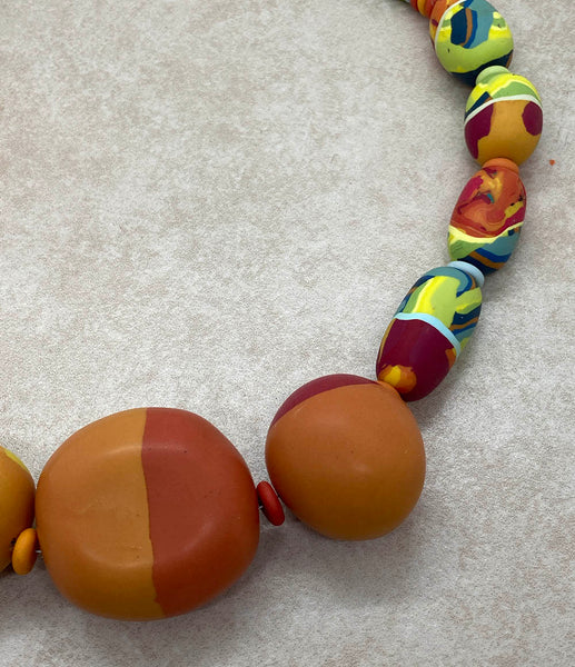 Large focal beads in reds and oranges as well as some of the medium size red and green beads